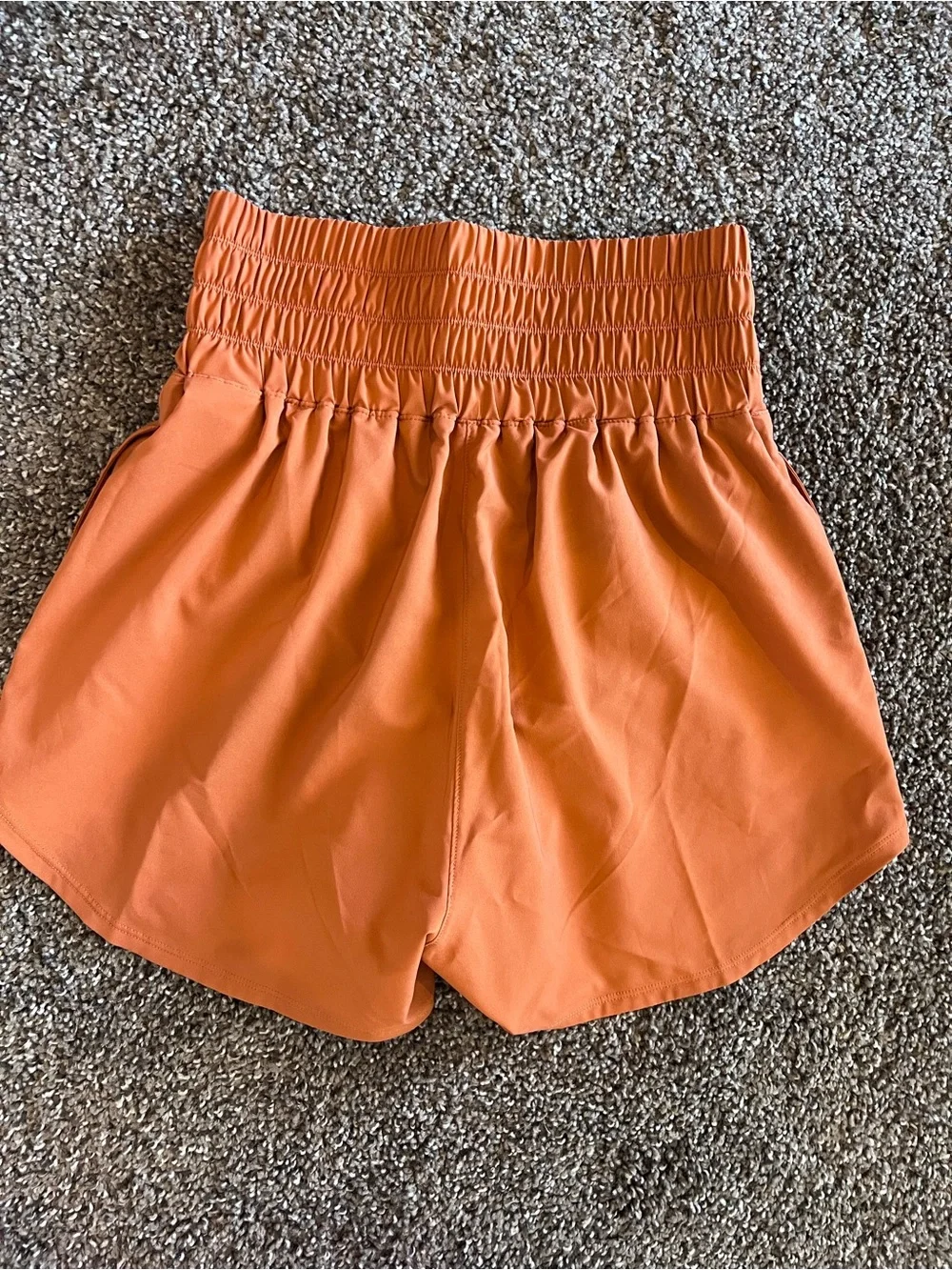 Nike Women's High-Waist Athletic Shorts in Burnt Orange with White Logos